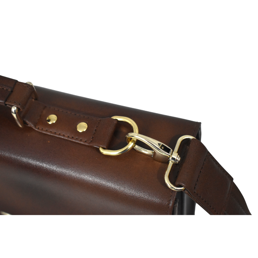 Brown cowhide leather briefcase with a top handle, adjustable shoulder strap, and gold-tone lock closure on the front flap