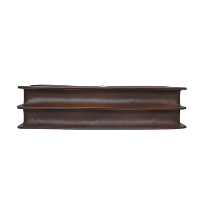 Brown cowhide leather briefcase with a top handle, adjustable shoulder strap, and gold-tone lock closure on the front flap