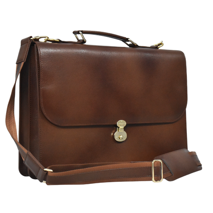 Brown cowhide leather briefcase with a top handle, adjustable shoulder strap, and gold-tone lock closure on the front flap
